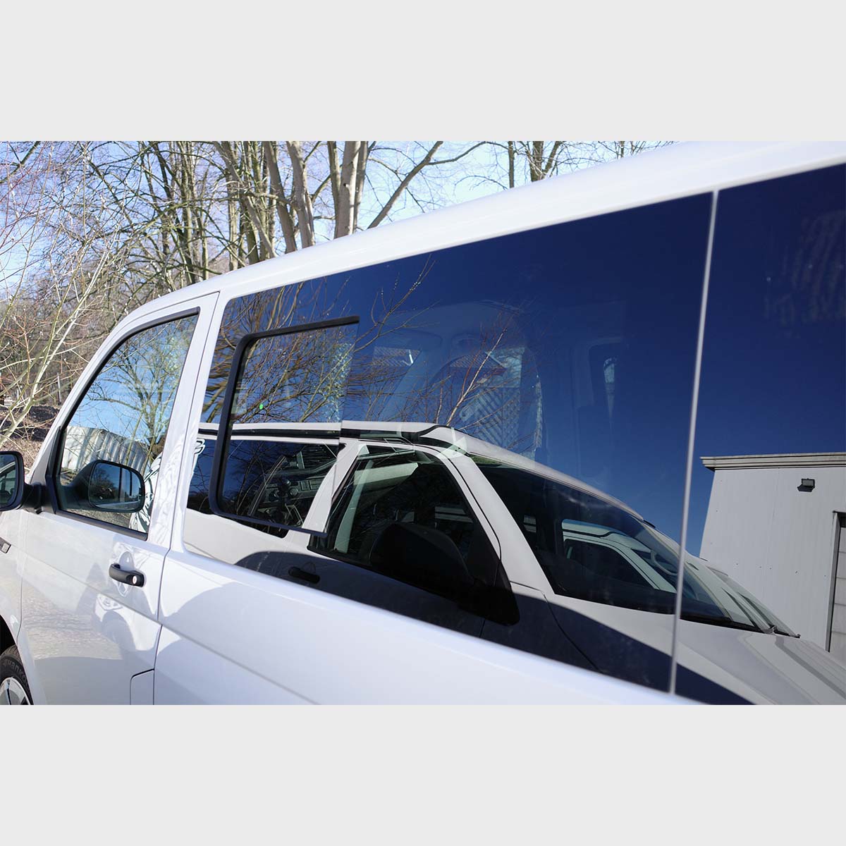 Tinted sliding window for T5-T6.1 vans, featuring a sleek, dark 80% tint on safety glass, designed for a perfect fit.